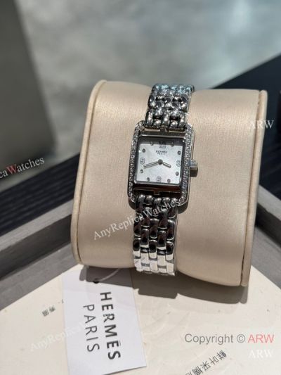 High Quality Replica HERMES CAPE COD Silver 316 Stainless Steel Bracelet Mother-Of-Pearl White Face Dial Stainless Steel Diamond Inlaid Case Watch 23x23mm